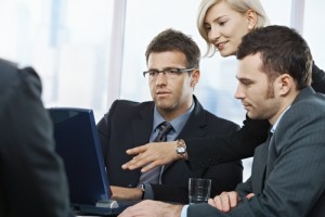 Businesspeople working together with a computer