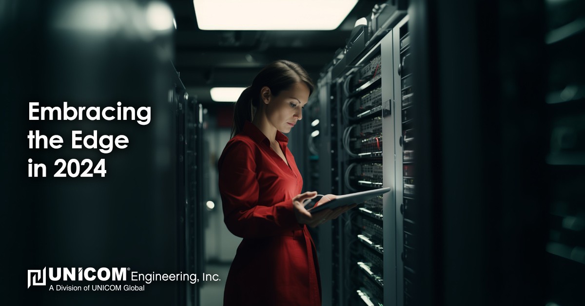 Woman in a server room, looking at a tablet.