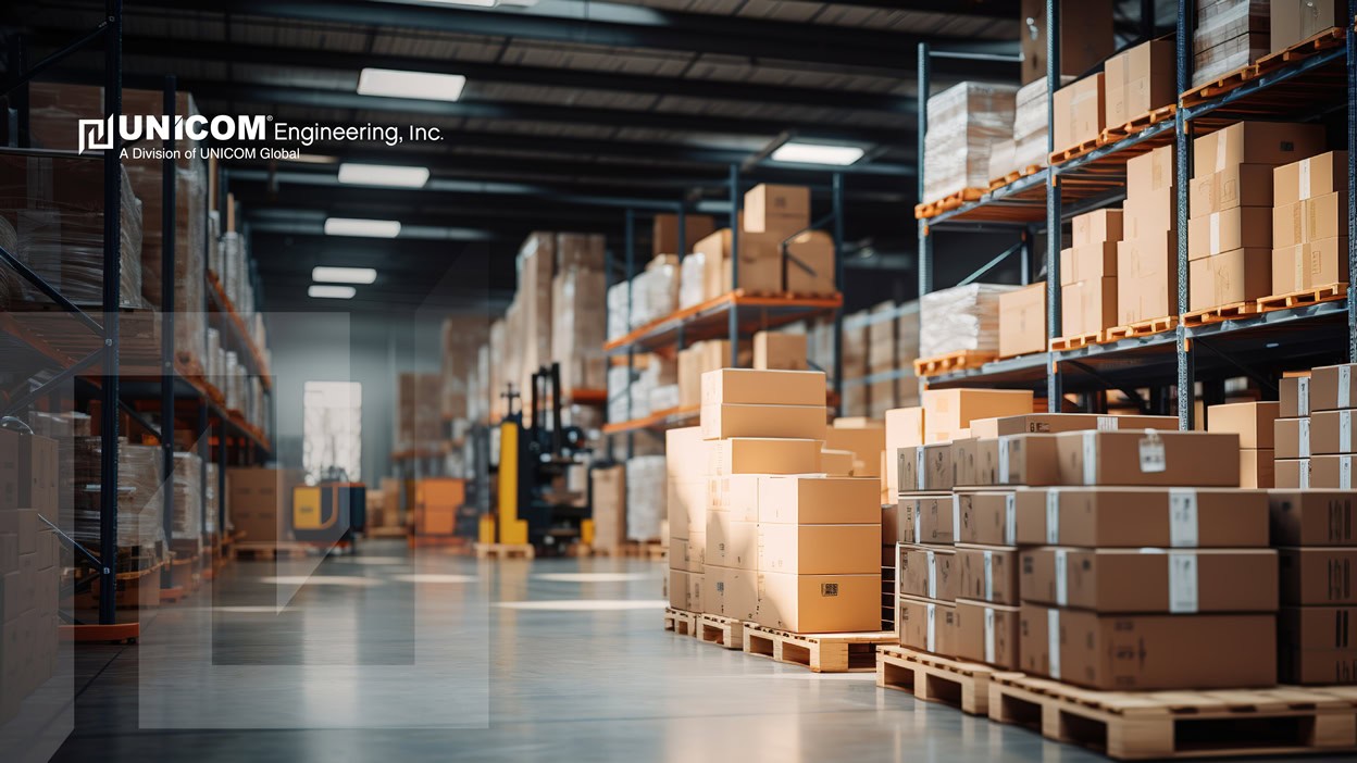 man viewing logistics on a tablet in a warehouse