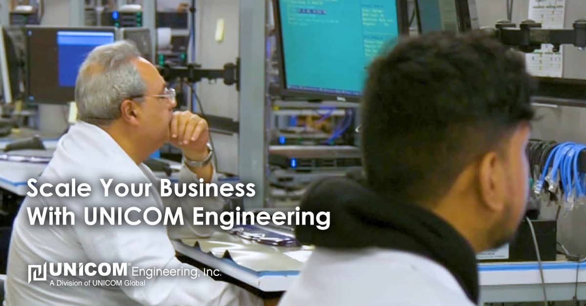 Two technology professionals at a workbench looking at computer screens. Text overlays the image that reads: Scale Your Business With UNICOM Engineering