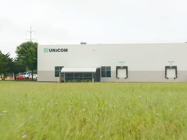 field overlooking UNICOM Engineering building
